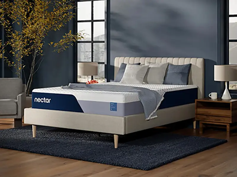 Nectar Classic Memory Foam 5.1 mattress displayed on a stylish bed frame in a modern bedroom setting, featuring a cooling quilted cover and layered foam support, emphasizing comfort and firm support.